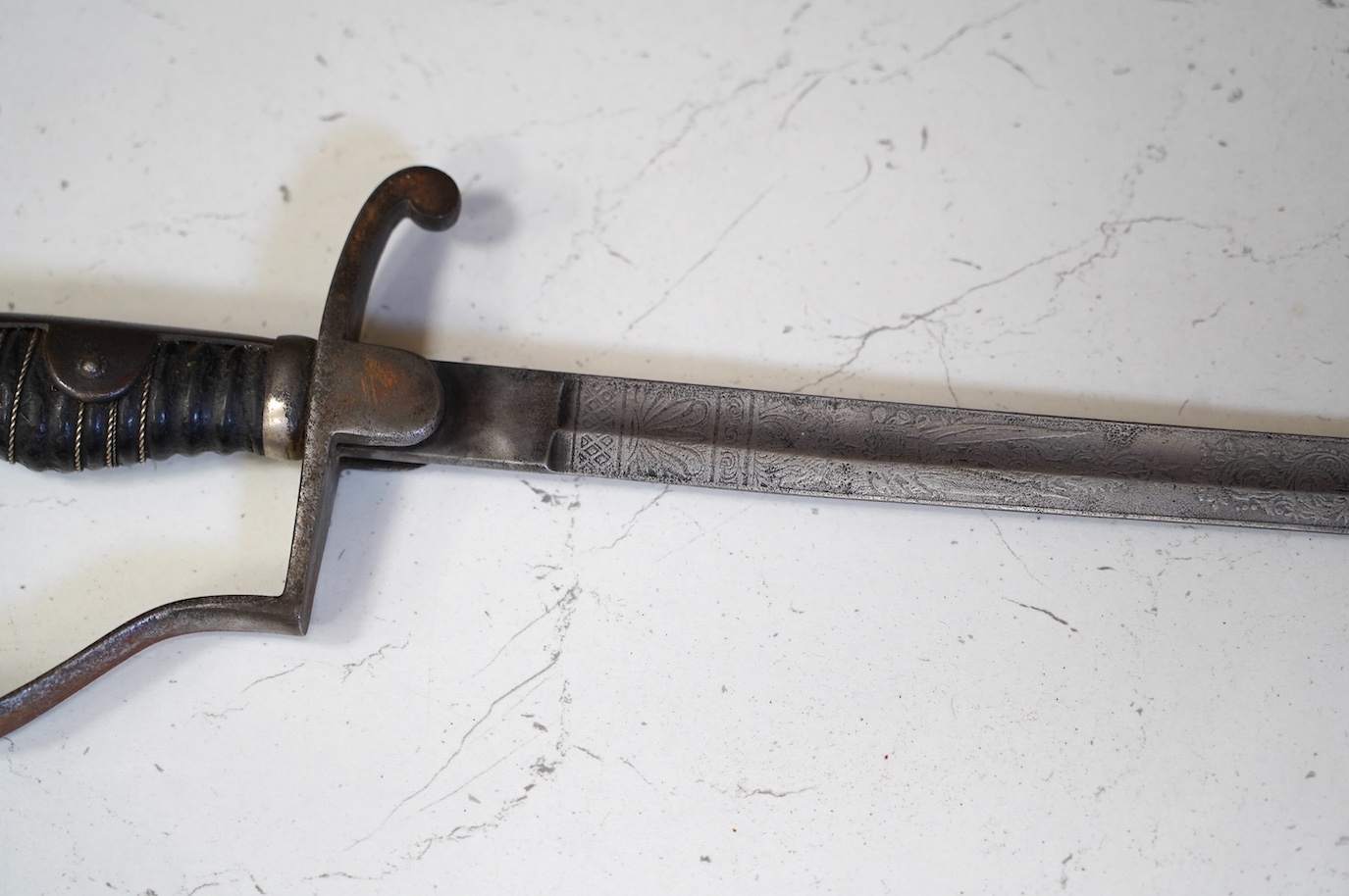 A Prussian artillery sword, etched blade, regulation hilt, blade 81cm. Condition - fair, well worn